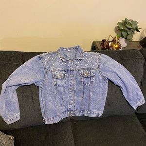 Jean jacket with pearls on it